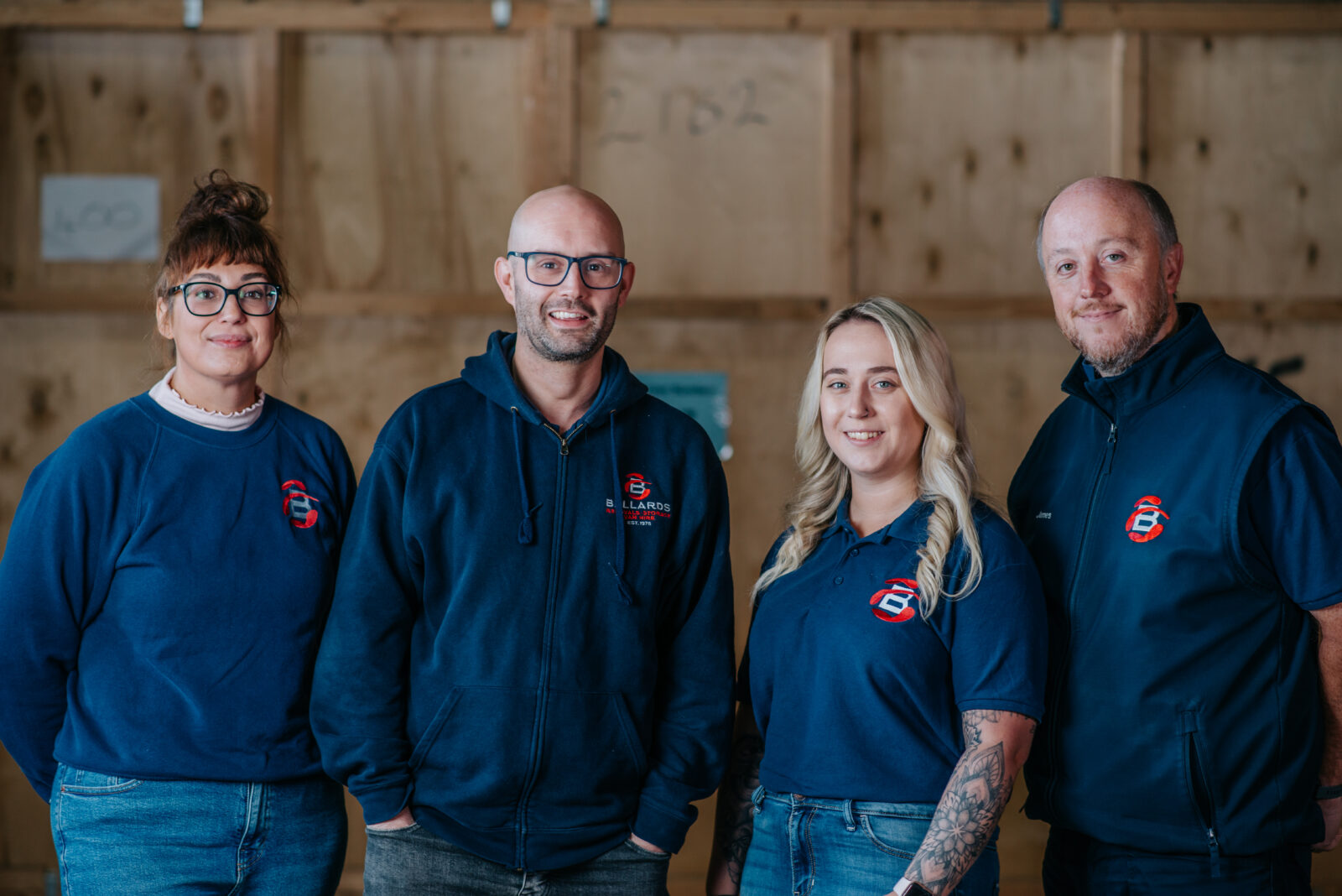 Ballards team members in their branded workwear smiling