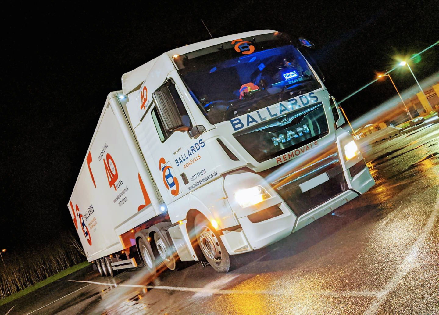 Ballards truck parked in exhibition centre car park at night - events and exhibition transportation